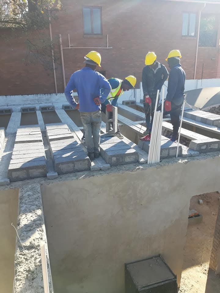 Team installing a concrete rib-and-block slab on a Sandton home