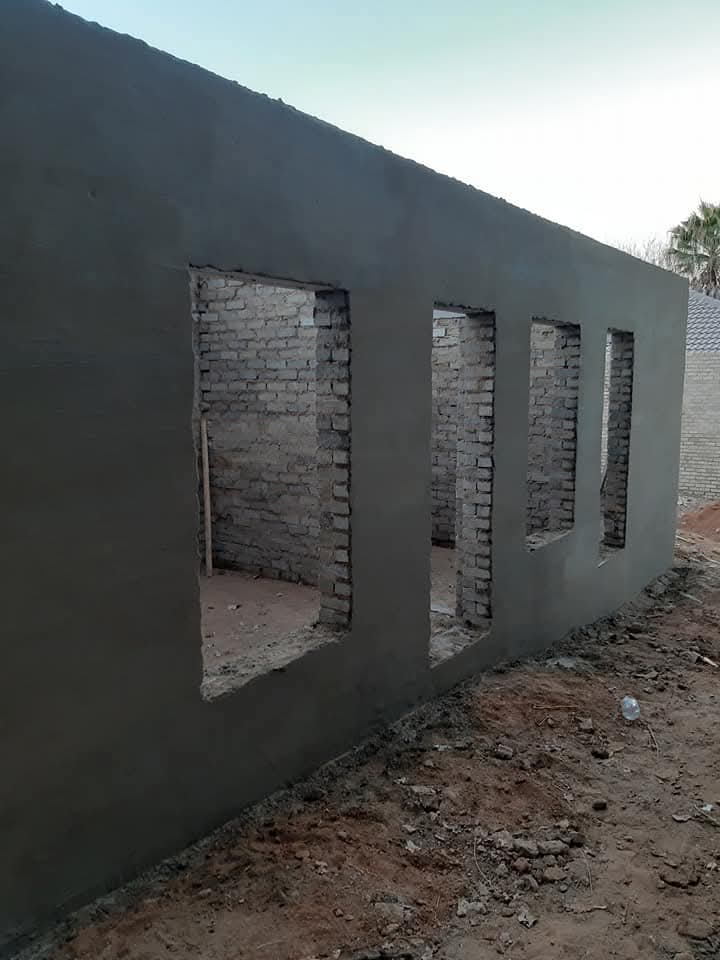 Freshly plastered exterior walls during property maintenance