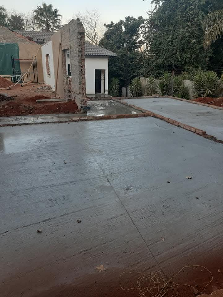 Freshly poured concrete surface bed for a home extension